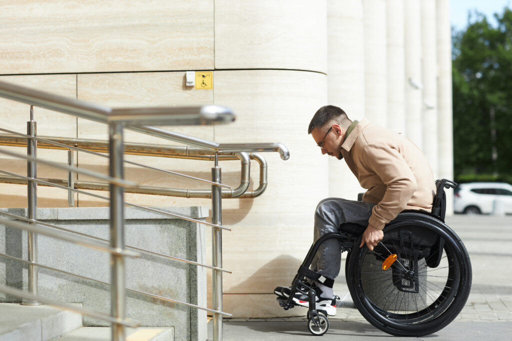 Man using wheelchair ramp